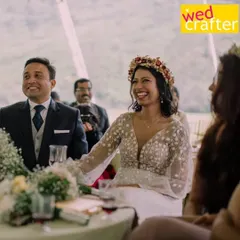 The beautiful bride, Sharon, laughing during her reception. Her floral crown and embroidered dress were perfect for their destination wedding.