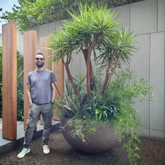 Our co-founder Angud standing next to one of our larger-than-life arrangements. This piece was put together in just a couple of hours for a special client's birthday bash.