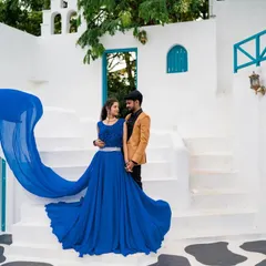 A duplicate of ID 162, this shot captures the full splendor of the bride's flowing blue dress, creating a dramatic and beautiful destination-style photo.