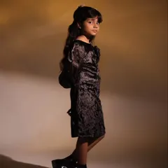 This colour portrait shows a different side of her personality. The warm studio lighting and confident pose highlight her style and readiness for the camera, perfect for an acting portfolio.