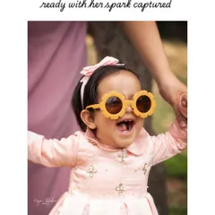 Always full of wonder and ready for the camera! A first birthday shoot is all about capturing their budding personality, and these fun, flower-shaped sunglasses brought out the biggest, happiest smile.