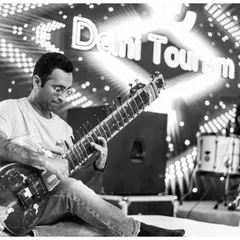 Performing with the legendary Indian rock band Parikrama for Delhi Tourism. This black and white shot captures the energy of our Sitar-Rock fusion.