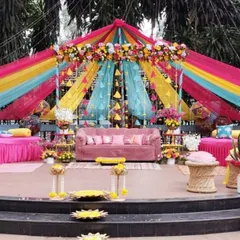 Another view of the multi-colored Mehendi stage, showing the full scale of the draping and the comfortable, stylish seating we provided for the couple and their guests.