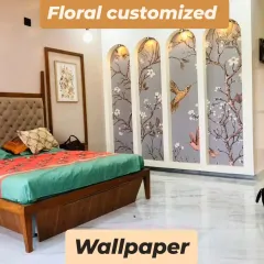 Wallpaper isn't just for walls. Here, we've applied a beautiful floral and bird-themed wallpaper to wardrobe doors set within arched niches, turning storage into a decorative feature.