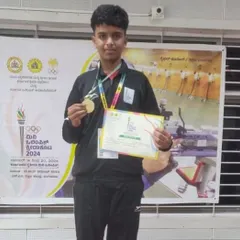 Smayan proudly displays his gold medal from the Mini Olympic Games, an event organized by the Karnataka Olympic Association. It's inspiring to see our young shooters excel in prestigious competitions.