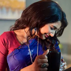 A candid moment captured during the shoot. The dewy skin finish catches the light beautifully, giving a healthy and radiant appearance that translates well on screen.