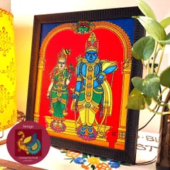 This Aandal Rangamannar painting, beautifully framed and ready to be gifted. The rich red background makes the divine figures stand out, making it a perfect, heartfelt 25th-anniversary gift for a wonderful couple.