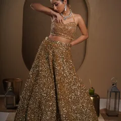 Another angle that captures the elegance of the outfit. The model's pose draws attention to the detailed blouse and the flattering cut of the lehenga, creating a look of pure sophistication.