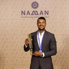 Mayank proudly displaying his award at the BCCI Naman awards. Success is a journey, not a destination, and he continues to strive for more.
