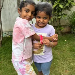Showing off their handmade friendship bands. The pride and joy in sharing something they've made with a friend is a beautiful thing to witness.