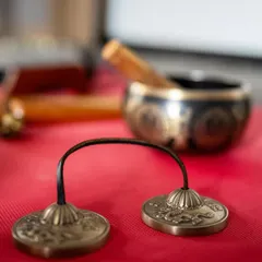 We use a variety of sound healing instruments, like these Tingsha cymbals, to create a rich and immersive soundscape. Their clear, high-pitched tone is used to focus the mind and clear energy.