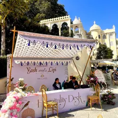 An elegant hospitality desk at The Everest Hill Resort, designed with traditional motifs and fresh flowers to welcome guests with warmth and style.