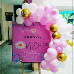A personalized welcome board for Tiera's "ONEderful" first birthday party. The custom sign, placed on an easel and decorated with a pink balloon garland, warmly greets guests as they arrive.
