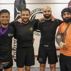 Made in India. Our coaches and fighters, some holding championship belts, represent the pinnacle of Indian MMA. We are proud to build champions from the ground up.