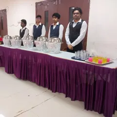 My staff ready at the buffet counter, which also includes a station for water and welcome drinks.
