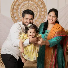 A candid, joyful moment from the same session. We love capturing the unposed interactions between parents and their children, showing the pure happiness of being together.