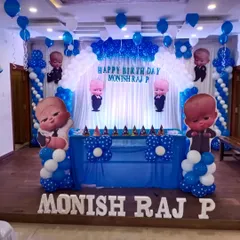 A complete Boss Baby themed decoration for Monish Raj P. This setup includes a custom backdrop, multiple character cutouts, and a balloon arch over the main table, perfect for a fun celebration.