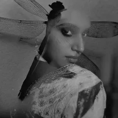 A black and white double exposure portrait created for the brand Ruhr India. This artistic technique merges a model's profile with the delicate wings of a dragonfly, resulting in a moody and ethereal image.