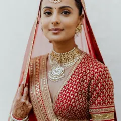 A classic red bridal look will never go out of style. For this bride, I created a soft glam look with defined eyes and a neutral lip, ensuring her natural beauty was the focus. This timeless makeup is perfect for the main wedding ceremony.