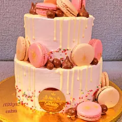For a touch of elegance, I created this two-tier birthday cake decorated with delicate macarons and a white chocolate drip. It's a perfect choice for milestone birthdays, corporate events, or any celebration that calls for a sophisticated dessert.