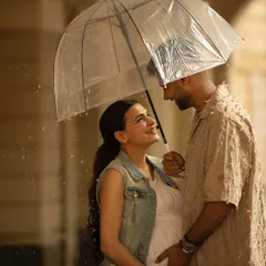 Let's embrace the city, even on a rainy day. An outdoor session in Mumbai can be incredibly romantic, using the urban backdrop and soft light to tell your unique love story.