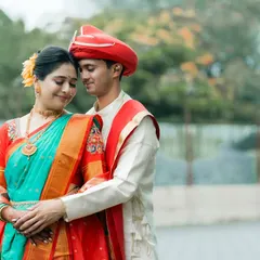 A classic and elegant pose from a Maharashtrian pre-wedding shoot. The couple's embrace and the rich colors of their traditional outfits create a timeless portrait.