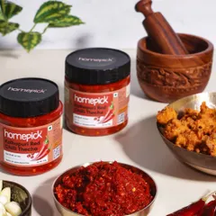 The fiery red of our Kolhapuri Red Chilli Thecha is a feast for the senses. Made with crushed garlic and roasted chillies, it carries the authentic story of Maharashtra's kitchens.