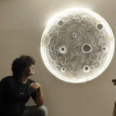 I love bringing big ideas to life, like this large, textured 3D moon wall art. It's crafted with multiple layers to create realistic craters and features a built-in backlight that gives it a magical glow. This piece transforms any room into a celestial escape.