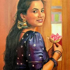 A lovely portrait of a woman in a purple saree holding a lotus flower. The client commissioned this as a gift, and I was so happy to capture her grace.