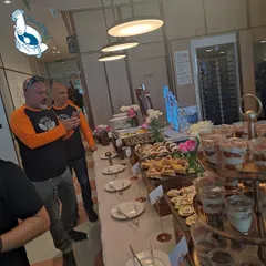Guests enjoying the hi-tea buffet at Dextrus Workspace. Seeing people connect and enjoy the food in a relaxed setting is what makes my work so fulfilling.