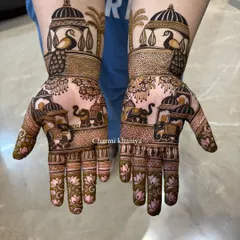 A gorgeous design for the Teej festival, filled with royal elements. This mehendi showcases proud peacocks in jharokhas and a procession of elephants, perfect for celebrating tradition.