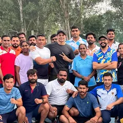 A group photo with fellow coaches and athletes. The community aspect of coaching is something I deeply value.