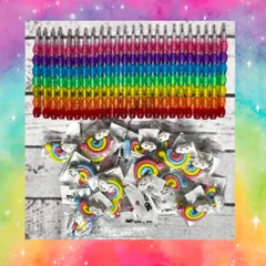 A closer look at the rainbow-themed stationery: a multi-color stackable pencil and a cute rainbow and cloud eraser.