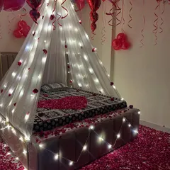 A close-up of the fairy light canopy, which creates a warm and dreamy glow in the room.