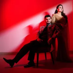A dramatic, high-fashion portrait using bold red lighting to create a glamorous, magazine-style look. This showcases my ability to craft stylized, Bollywood-inspired pre-wedding photos.