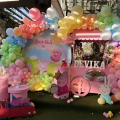 Bringing the cheerful world of Peppa Pig to life for a memorable 3rd birthday. This vibrant setup includes a custom backdrop, a rainbow balloon arch, and character cutouts, all designed to create an immersive and fun experience for the little ones.