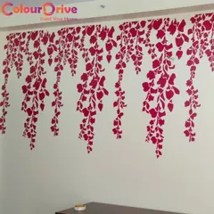 This wall features a hanging vine stencil pattern in a bold magenta. It's a great way to create a dramatic feature wall, especially for a bedroom or guest room, adding a pop of color and a nature-inspired theme.