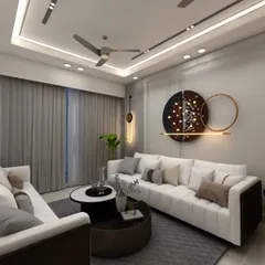 A contemporary living room where comfort is key. The plush L-shaped sofa, modern art piece, and layered lighting create a space that is both stylish and incredibly inviting.