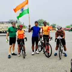 The group stands together with the flag, showing our unity and pride on Independence Day.