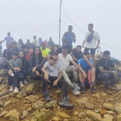 The whole group celebrating together at the top of Kudremukha. The smiles say it all.