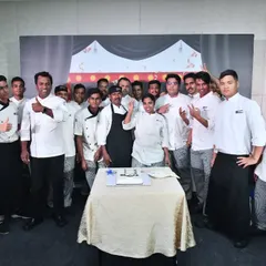 The entire kitchen team celebrating International Chef's Day. Their collaboration and energy are the secret ingredients to our success.