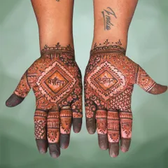 This design was for an Anumodana ceremony. The sacred words 'Varshitap' and 'Anumodana' are placed centrally within a diamond-shaped frame, surrounded by traditional Indian patterns.