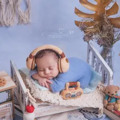 Listening to my favorite playlist. This little music lover is chilling in his tiny bed with headphones and a radio, a fun and modern theme.
