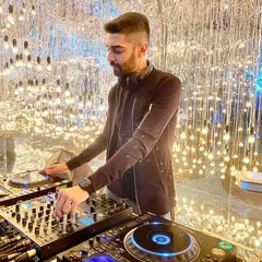 Spinning tracks in a venue with incredible lighting. The right ambiance is key, and I work with the lighting technicians to create a visual experience that matches the music.