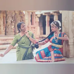 My Guru, Bhanu ma'am, adjusting my hair during my Rangapravesha photoshoot. She chiseled every bit of an awkward teenager into a dancer.