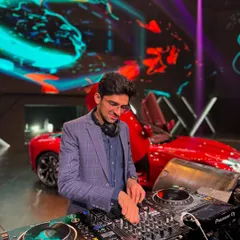 Playing a set for a corporate event with MG Motor India. I was photobombed by one of their slick red cars, which made for a cool and unique DJ booth backdrop.