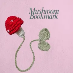 This is my crochet mushroom bookmark, perfect for anyone with a cottage-core aesthetic. The little red mushroom cap peeks out from the top of your book, and the leafy vine keeps your page.