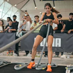 The sled pull is a test of pure pulling strength and grip. Here I am, locked in, with the crowd watching. We train for this exact scenario, building the back and core strength needed to conquer this station efficiently.
