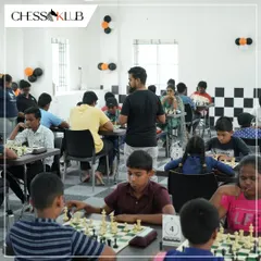 A wide shot of our Coimbatore center during the grand opening tournament, filled with young players engaged in intense matches.