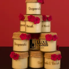 Personalization is at the heart of what I do. For Deepanshi and Harsh's wedding, I created these rustic jute-wrapped candles with their names, making for a truly memorable and personal return gift for their guests.